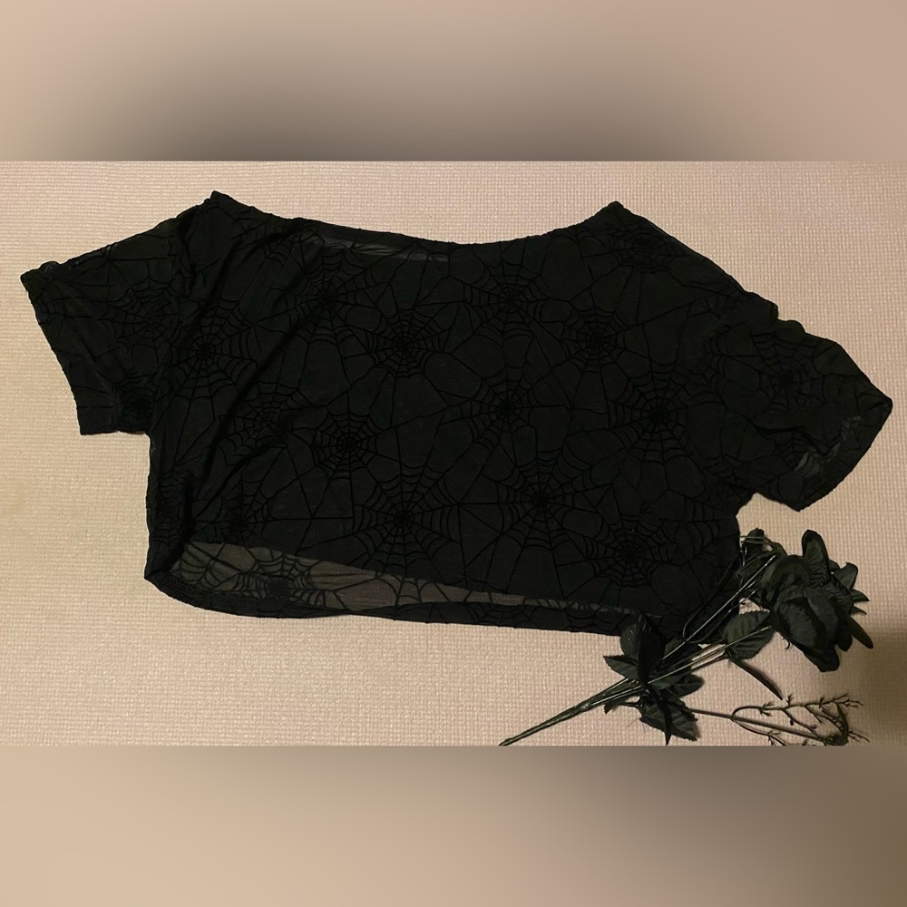 An off shoulder mesh top.